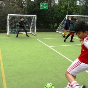 boys playing football