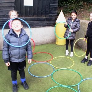 children playing with hola hoops