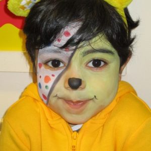 child with pudsy bear face paint