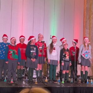 children singing on stage